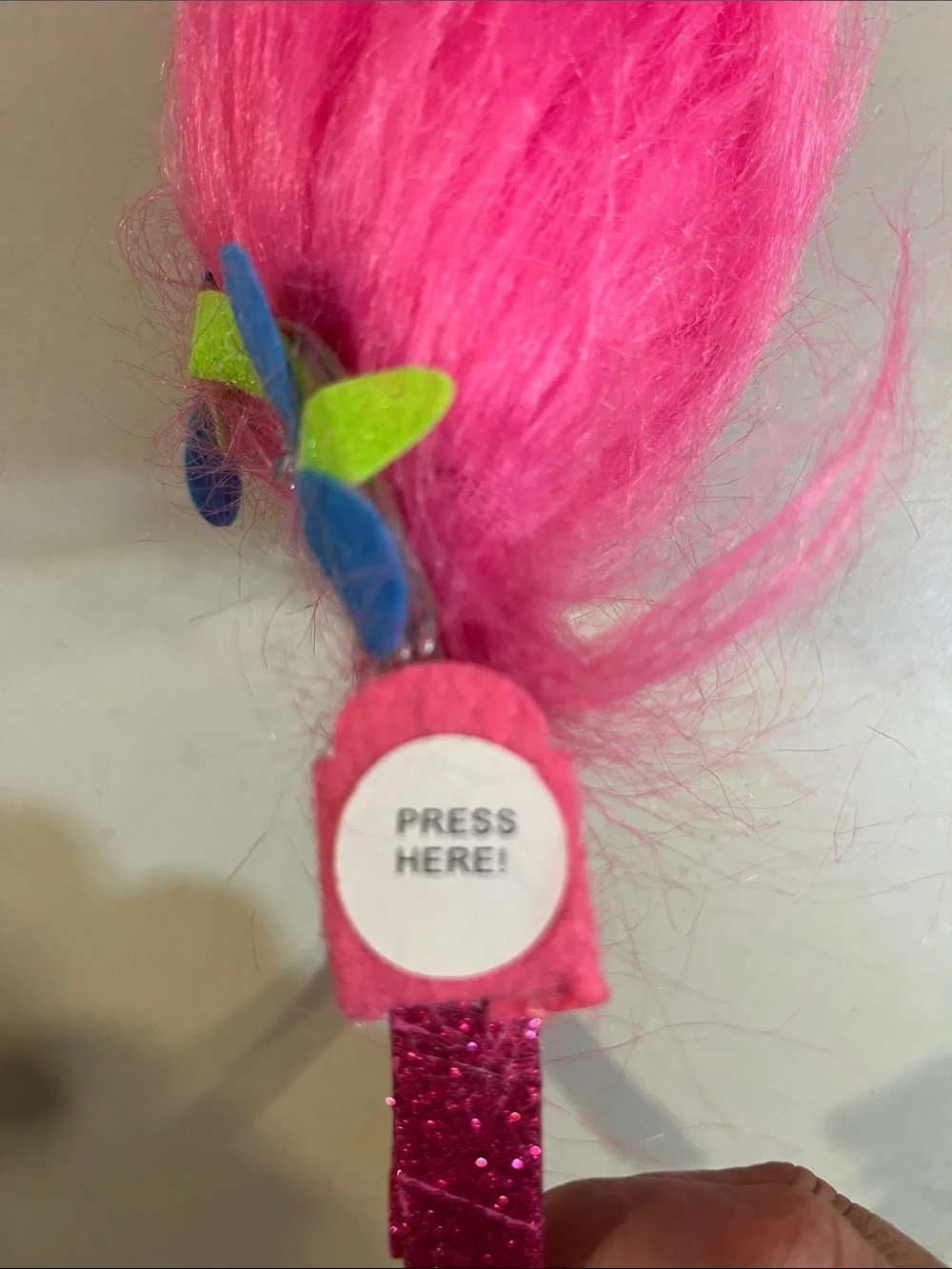 Trolls Bright Pink Faux Fur Headband with Blue and Lime Flowers